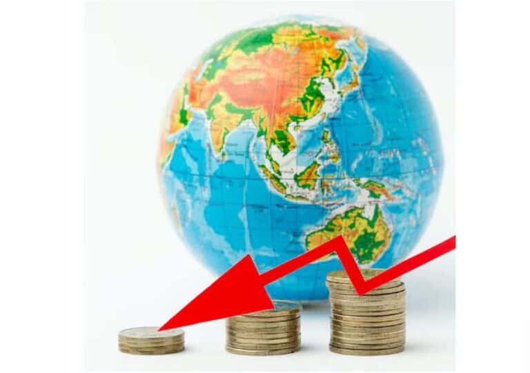 Globe behind declining coin stacks with red arrow