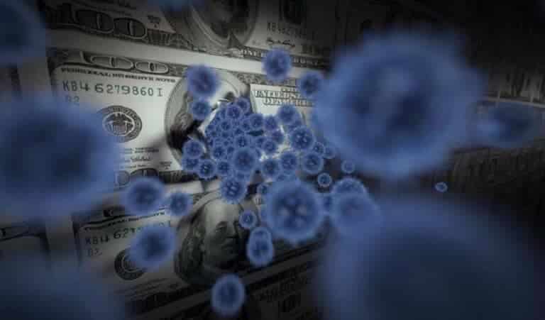 Virus particles over US hundred-dollar bills