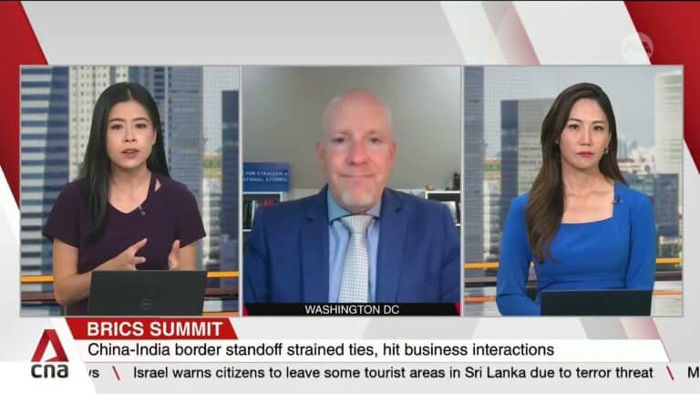 News broadcast split-screen discussing BRICS summit tensions