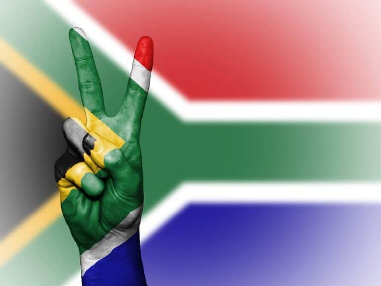 Hand painted with South African flag making peace sign