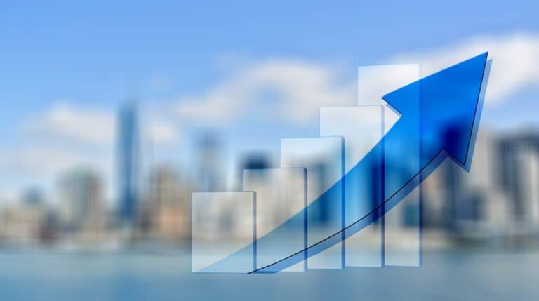 Upward arrow graph over city skyline background