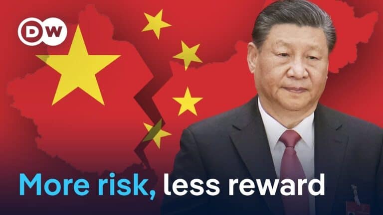 Man in suit before cracked China flag graphic
